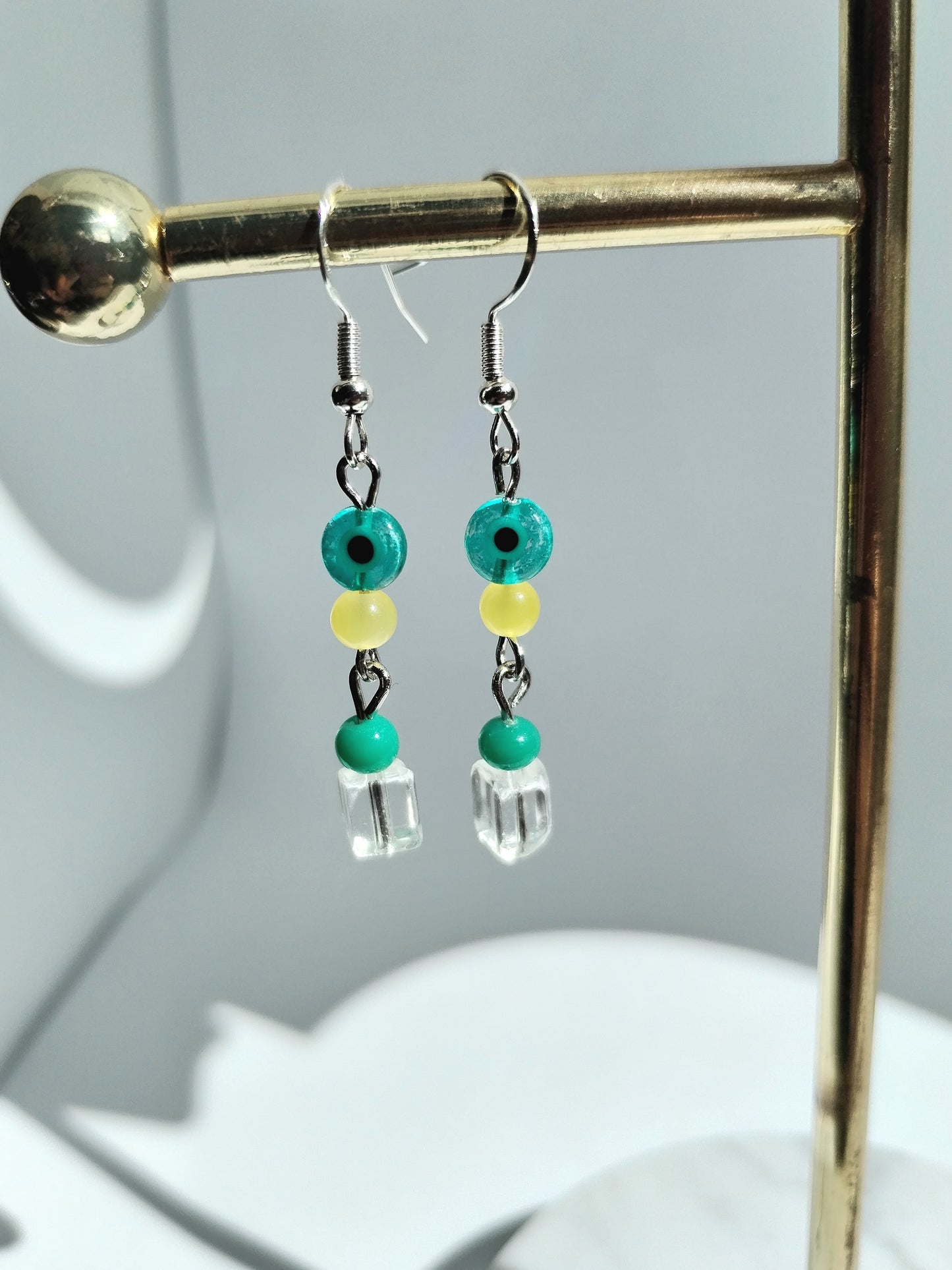 Green evil eye beaded earrings