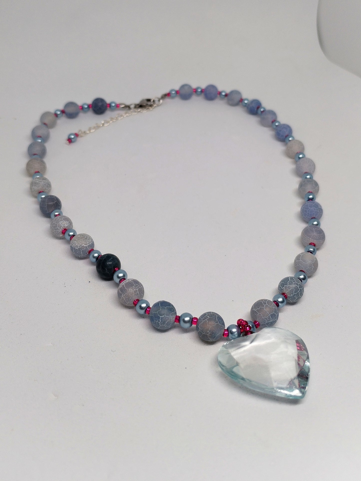 Blue & pink beaded necklace with a heart pendant
